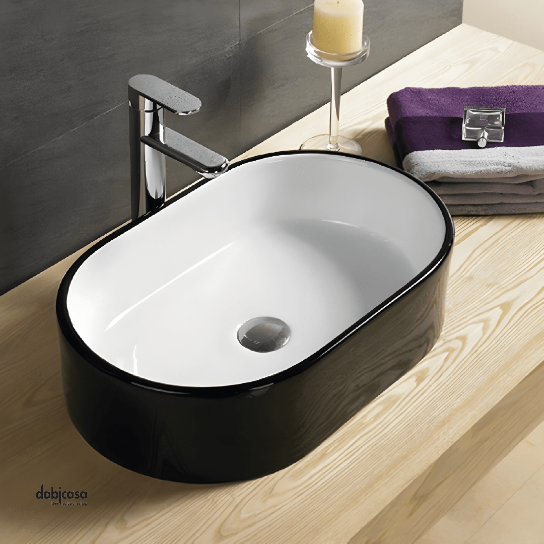 Lavabo D'Appoggio Ovale "Break The Rules" Da 55 Cm In Ceramica Finitura Nero Lucido/Bianco Lucido - Dabicasa